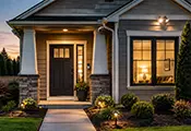 Well-lit home entrance with a front door and window, illustrating residential door and window security.